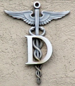 Medical caduceus symbol with a big letter D on it