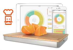 Image of the Prep Pad with Oranges on it and an iPad & iPhone behind it